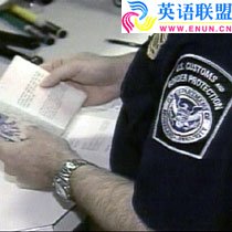 A U.S. Customs officer inspects visa documentation